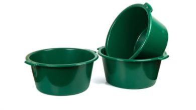 green plastic basins with white background